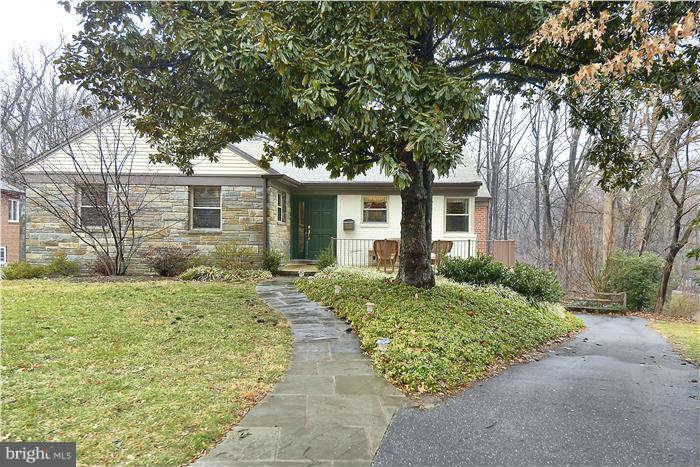 9314 Harvey Road Silver Spring, MD 20910 - Photo 1 of 7 front view of a house with a yard