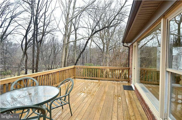 9314 Harvey Road Silver Spring, MD 20910 - Photo 3 of 7 a view of balcony with wooden floor and fence
