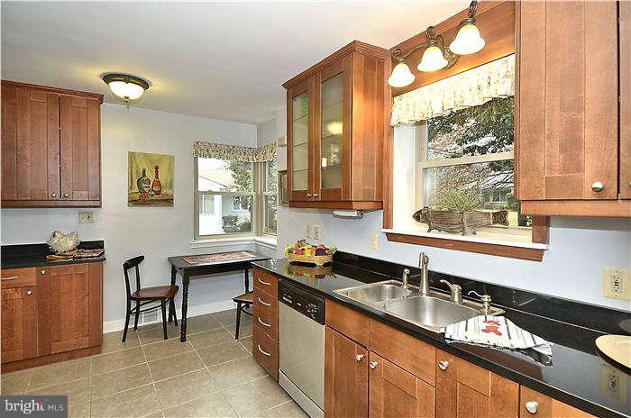 9314 Harvey Road Silver Spring, MD 20910 - Photo 6 of 7 a kitchen with granite countertop a sink and a stove