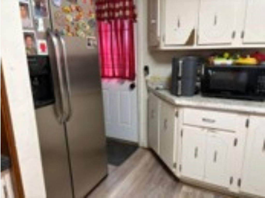1120 Beverly Road McKeesport, PA 15133 - Photo 4 of 12 a kitchen with stainless steel appliances cabinets and a counter top space
