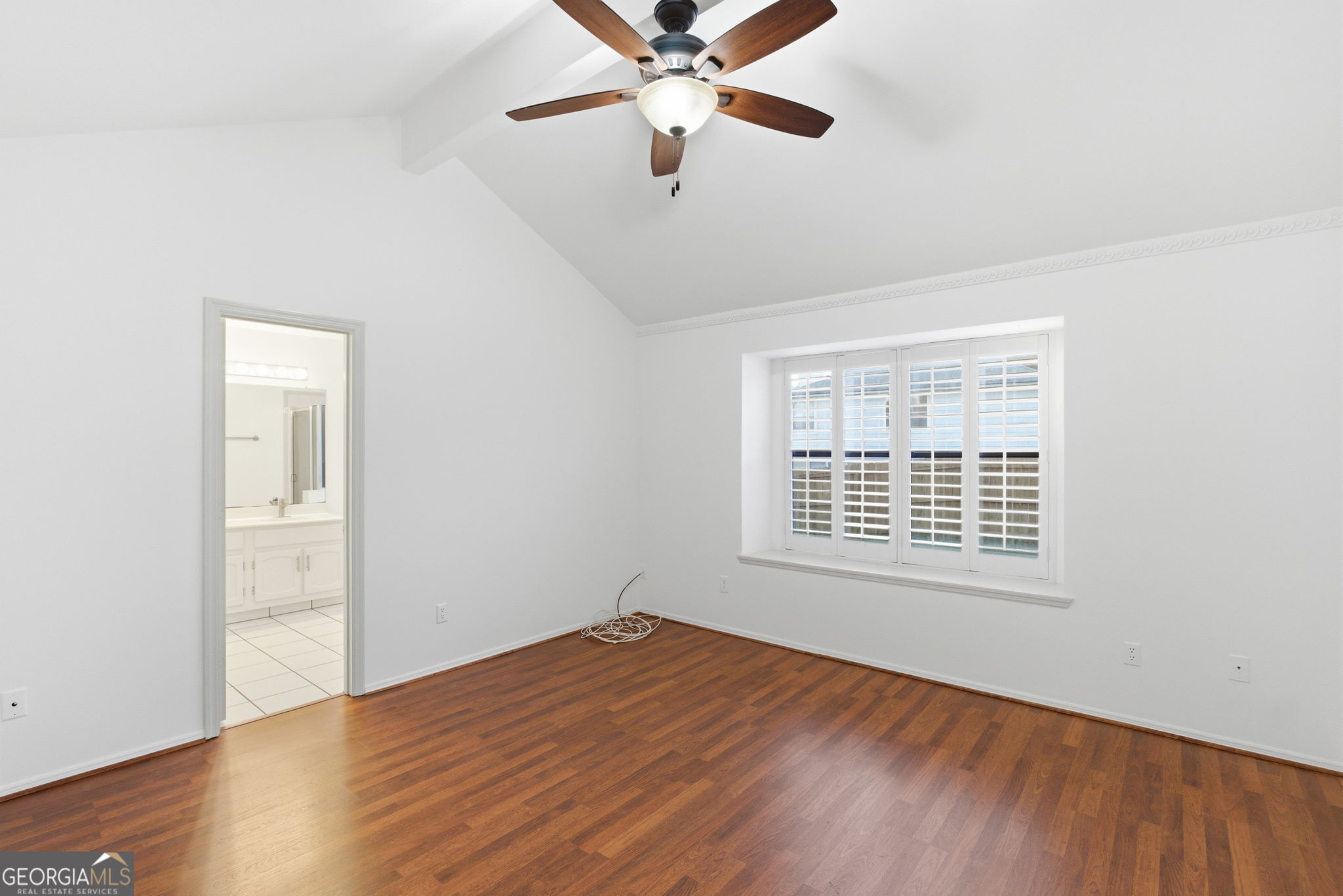 523 North Shore Road Lithonia, GA 30058 - Photo 14 of 26 a view of an empty room with wooden floor and a window