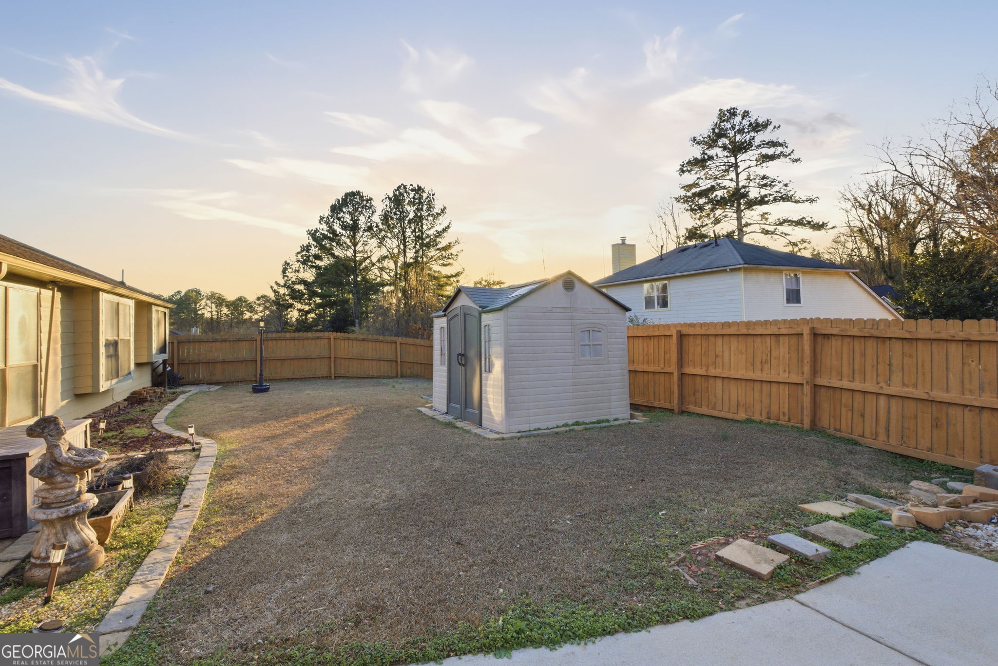 523 North Shore Road Lithonia, GA 30058 - Photo 26 of 26 a view of backyard with small garden