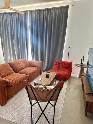6690 Saddleback Road Joshua Tree, CA 92252 - Photo 9 of 48 a living room with furniture and a chair
