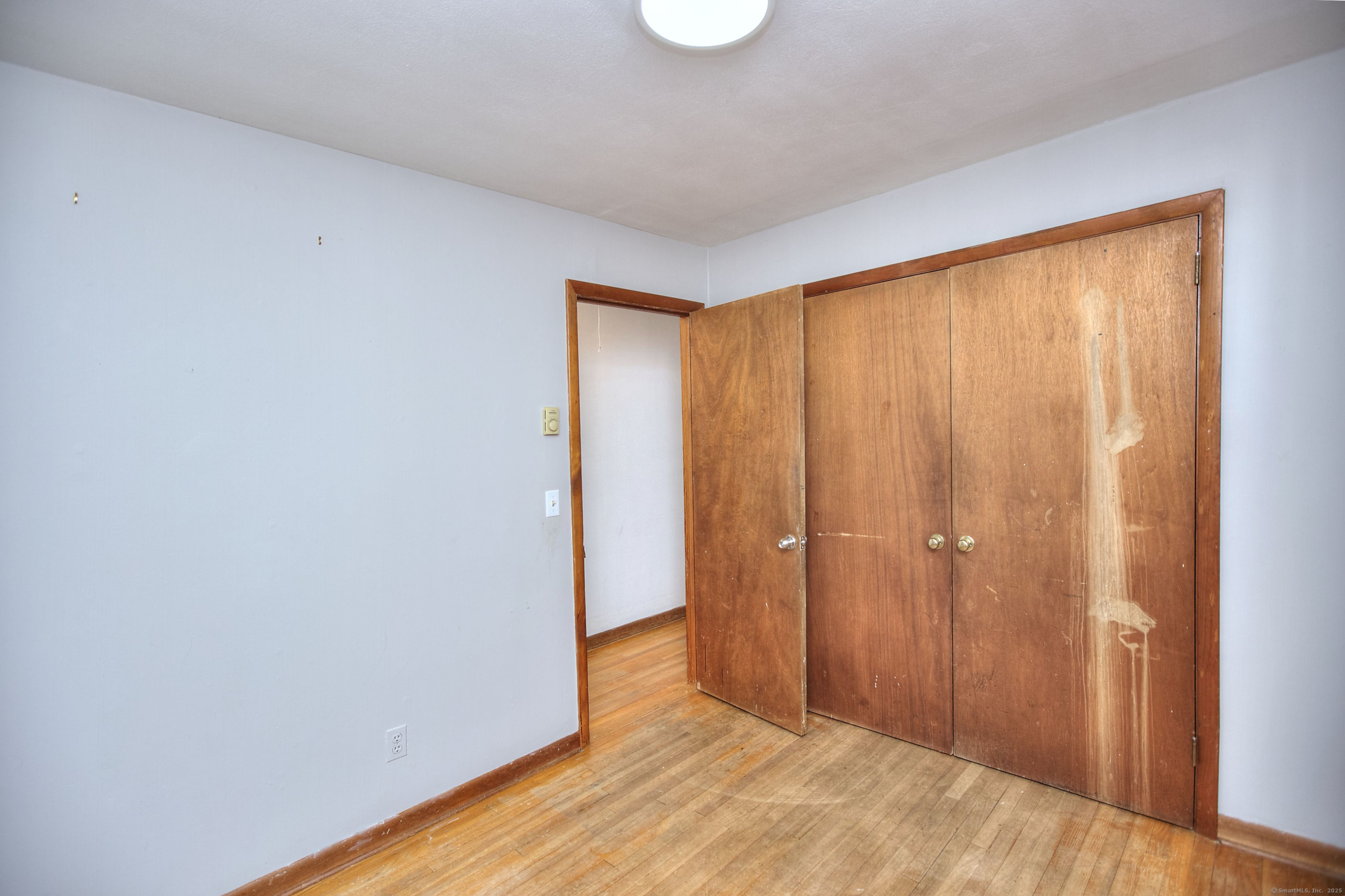 489 Main Street Westport, CT 06880 - Photo 13 of 40 a view of an empty room with wooden floor