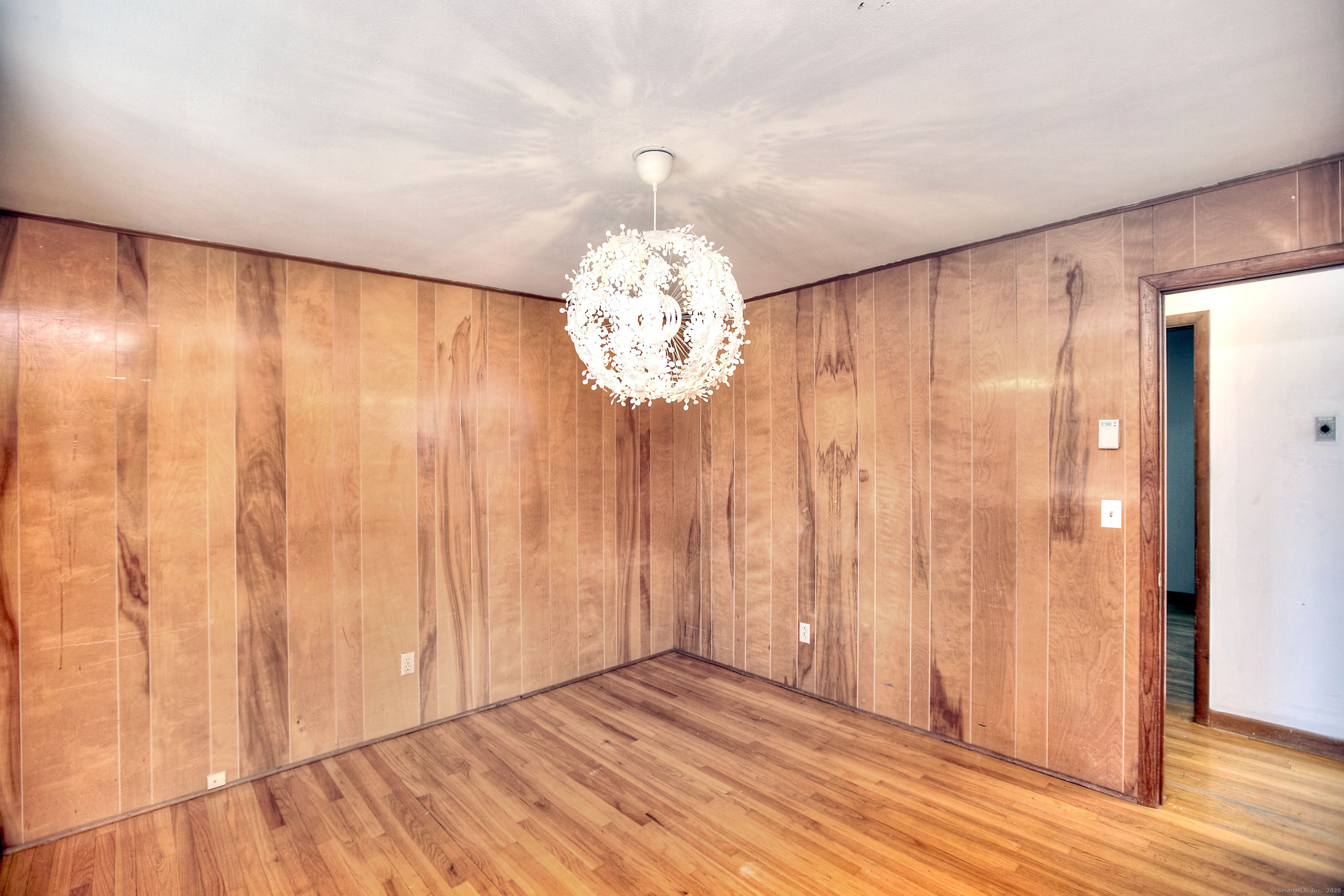 489 Main Street Westport, CT 06880 - Photo 15 of 40 a view of an empty room with wooden floor and a window