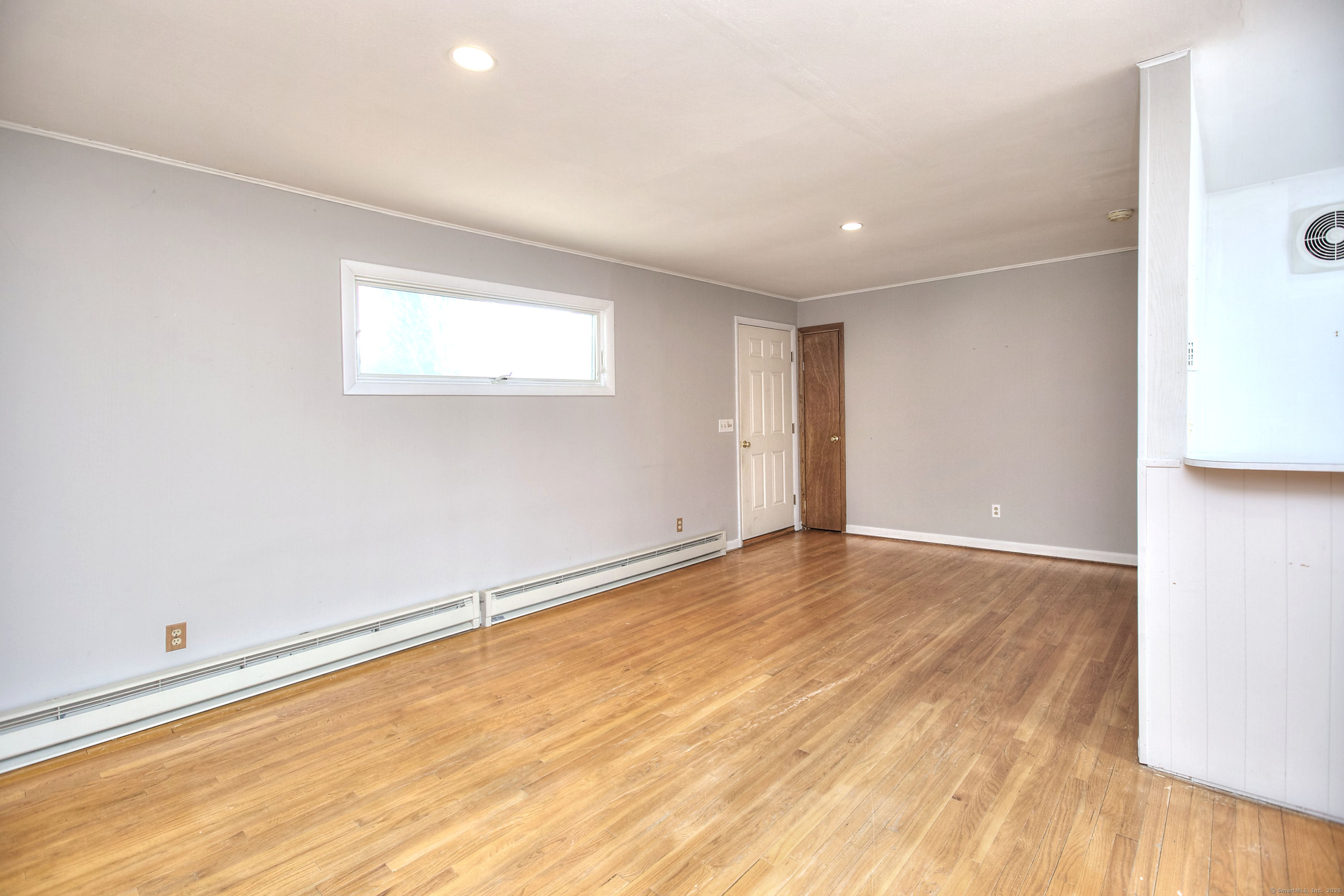 489 Main Street Westport, CT 06880 - Photo 19 of 40 an empty room with wooden floor and windows