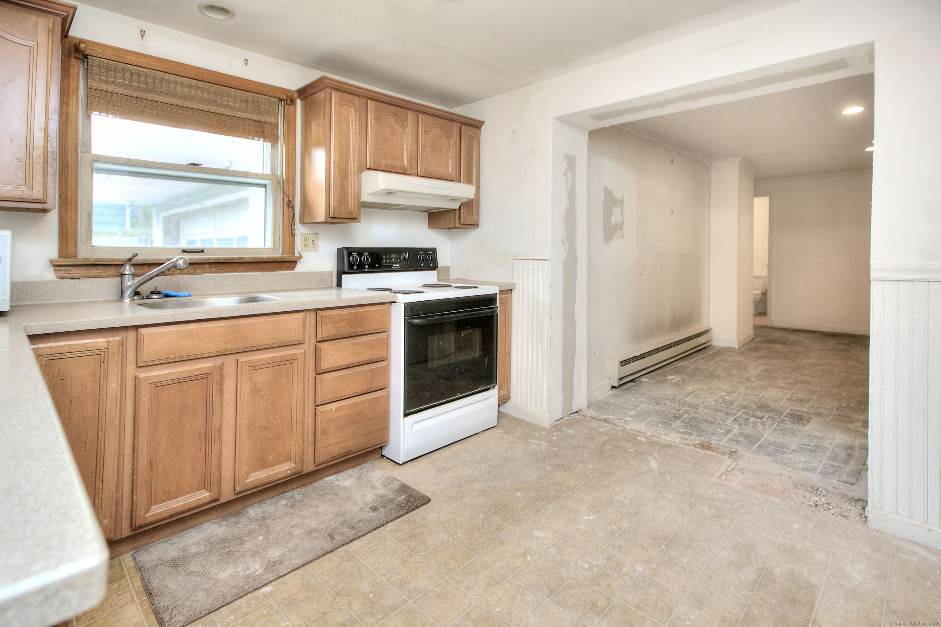 489 Main Street Westport, CT 06880 - Photo 24 of 40 a kitchen with stainless steel appliances granite countertop a stove a sink and a refrigerator