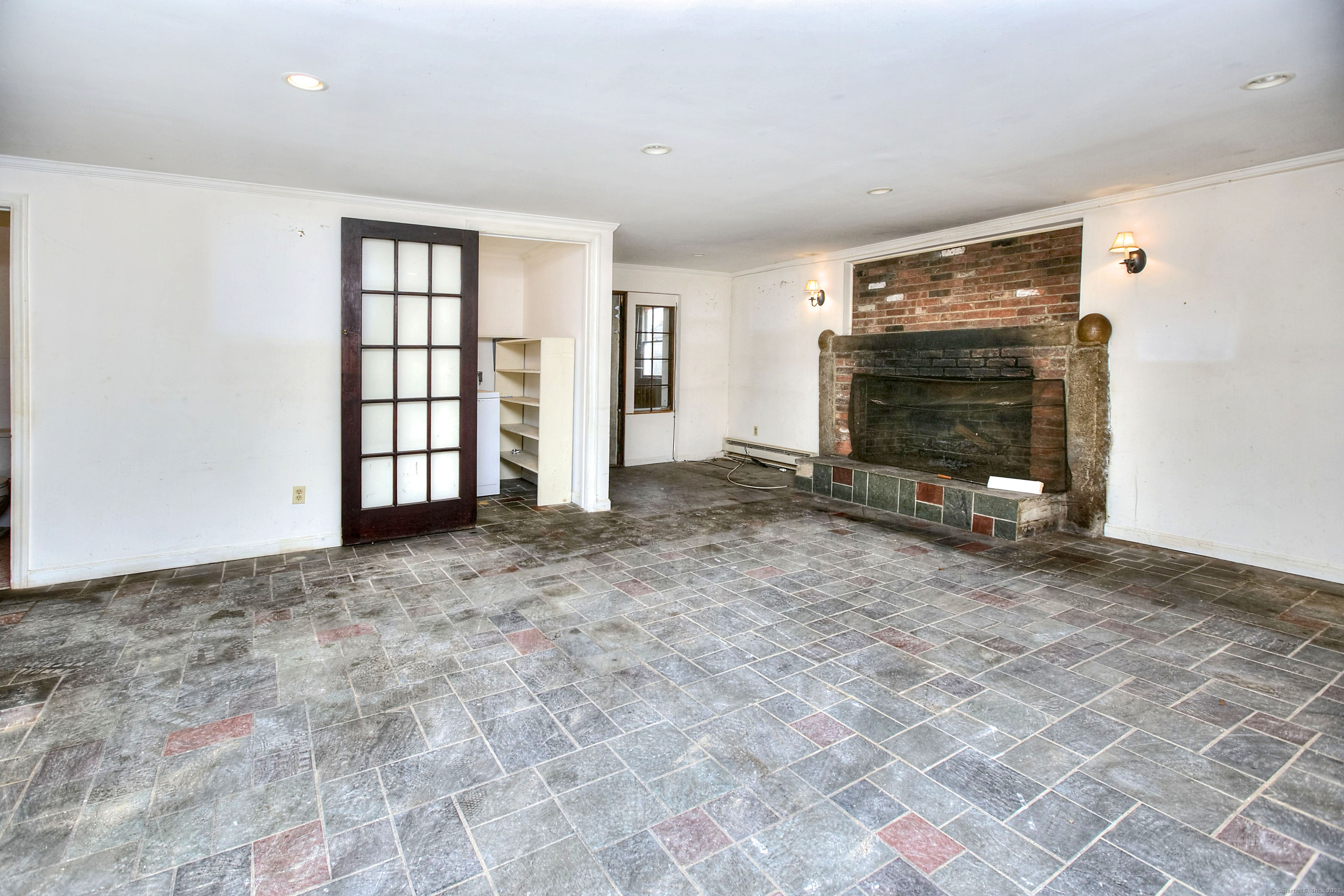 489 Main Street Westport, CT 06880 - Photo 28 of 40 a view of an empty room with a fireplace