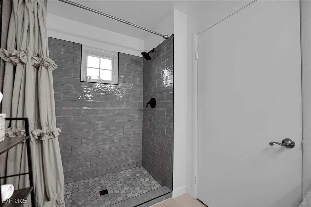 1909 Mountain Hills Court, Unit 205 Las Vegas, NV 89128 - Photo 27 of 34 Full bathroom featuring a shower stall
