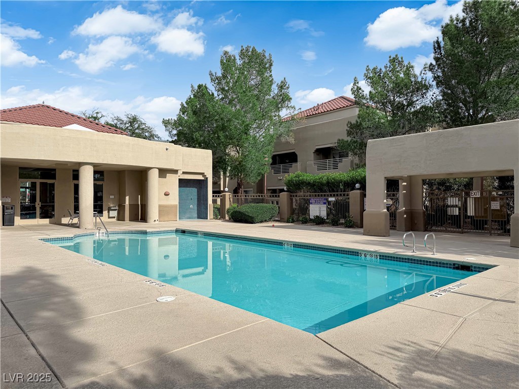 1909 Mountain Hills Court, Unit 205 Las Vegas, NV 89128 - Photo 5 of 34 Community pool with a patio area