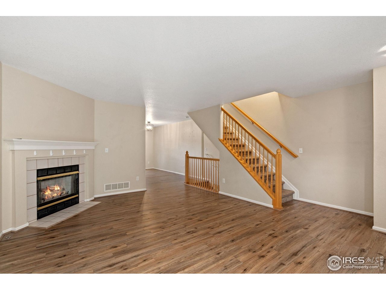 6612 Avondale Road, Unit 2B Fort Collins, CO 80525 - Photo 2 of 20 Living room and fireplace on main level