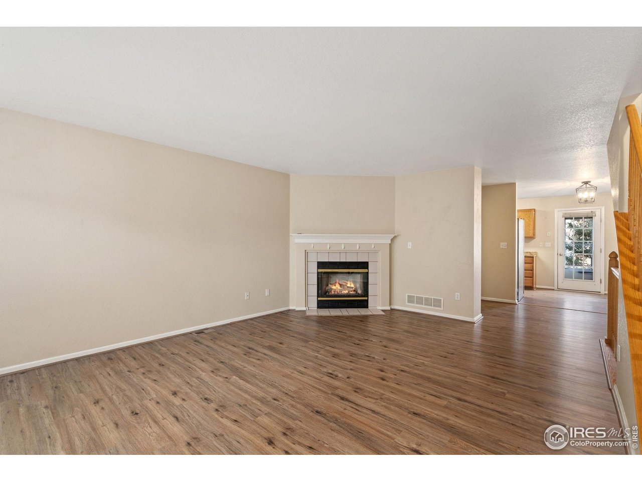 6612 Avondale Road, Unit 2B Fort Collins, CO 80525 - Photo 4 of 20 Living room and fireplace on main level