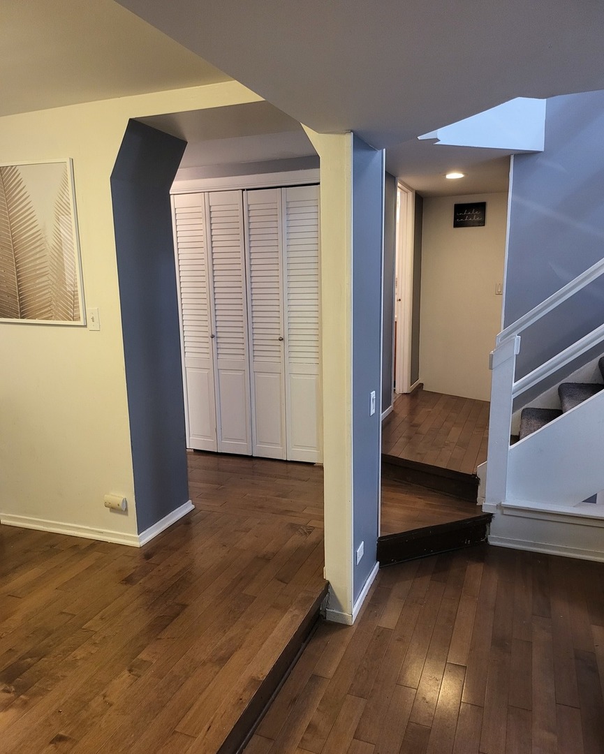 6337 Roosevelt Road, Unit 105 Berwyn, IL 60402 - Photo 6 of 20 a view of bedroom and bedroom with wooden floor