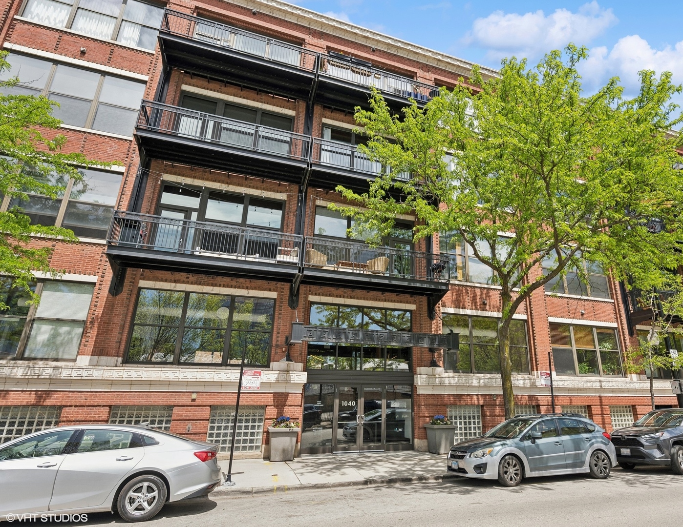 1040 West Adams Street, Unit 601 Chicago, IL 60607 - Photo 1 of 13 a car parked in front of a building