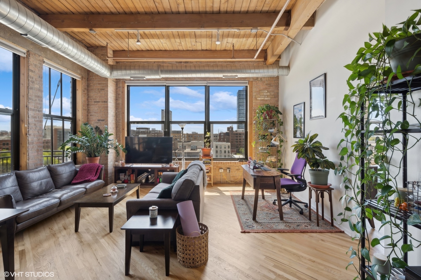 1040 West Adams Street, Unit 601 Chicago, IL 60607 - Photo 4 of 13 a living room with furniture and a large window