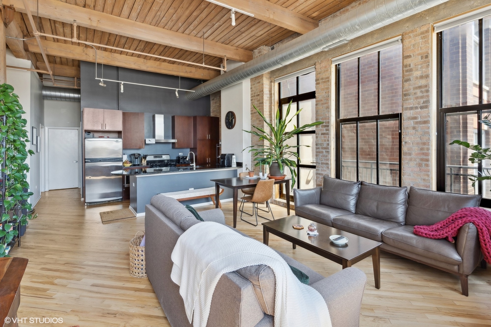 1040 West Adams Street, Unit 601 Chicago, IL 60607 - Photo 5 of 13 a living room with furniture and a large window