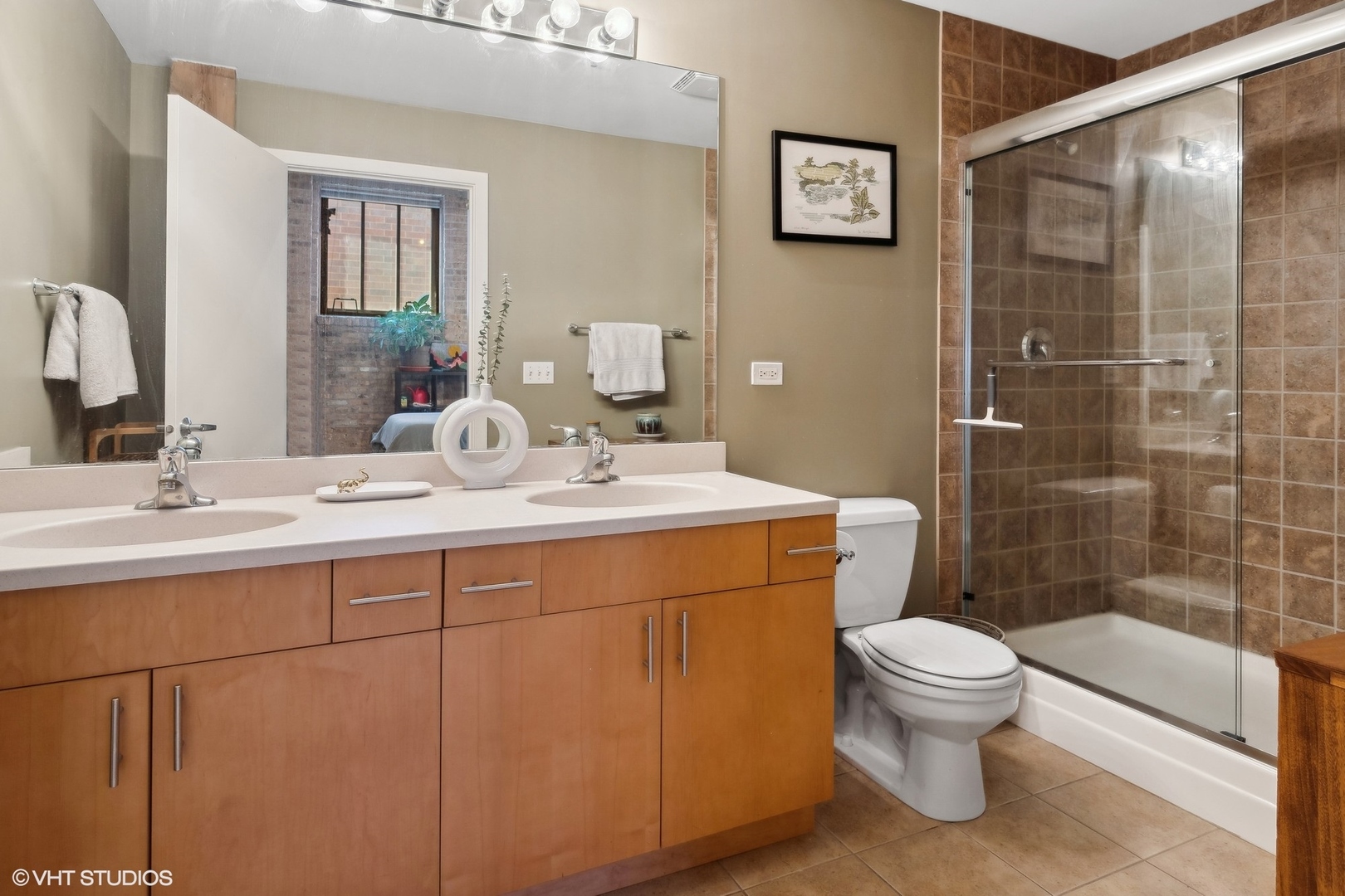 1040 West Adams Street, Unit 601 Chicago, IL 60607 - Photo 9 of 13 a bathroom with a sink toilet and shower