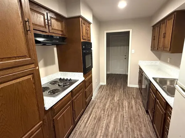 a kitchen with a stove oven and a refrigerator