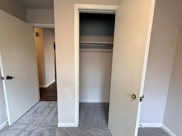 a view of a kitchen from the hallway