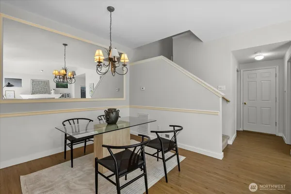 a view of a dining room with furniture and wooden floor