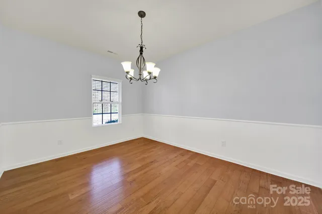 a view of a dining room with furniture window and flowerpot