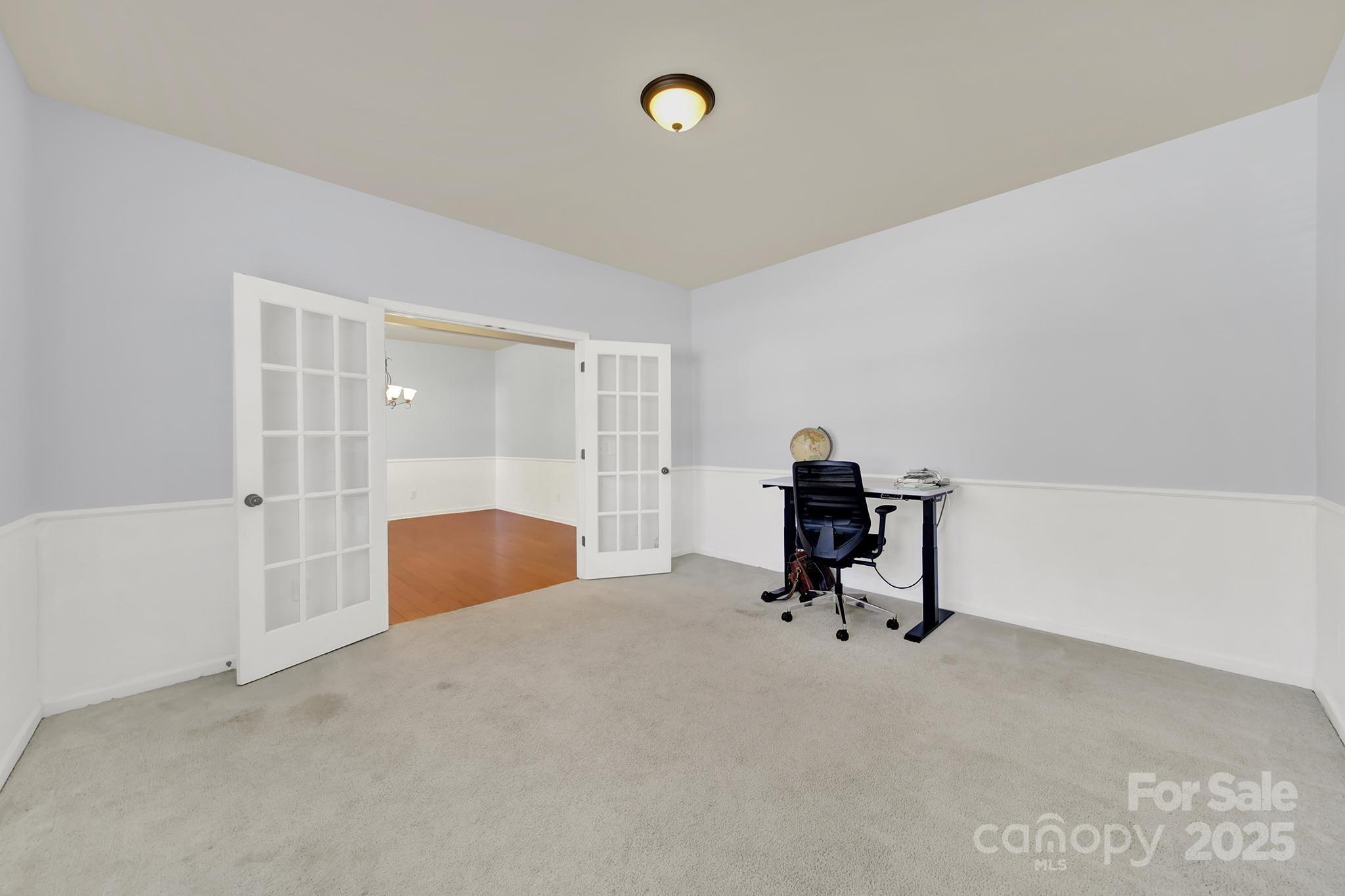 1726 Still River Way Fort Mill, SC 29708 - Photo 15 of 45 a room with a desk and gym equipment