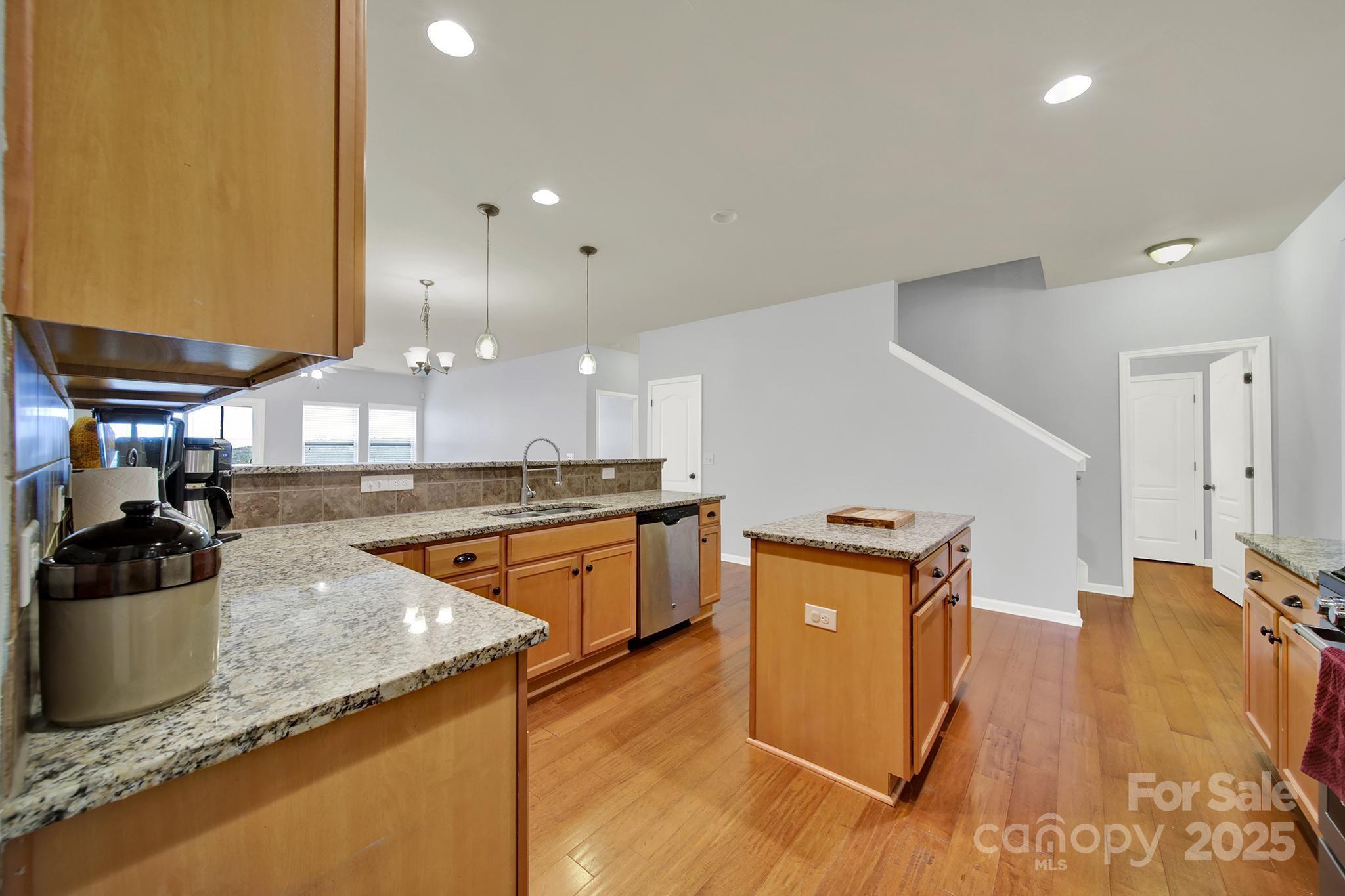 1726 Still River Way Fort Mill, SC 29708 - Photo 18 of 45 a kitchen with a sink a counter top space and stainless steel appliances