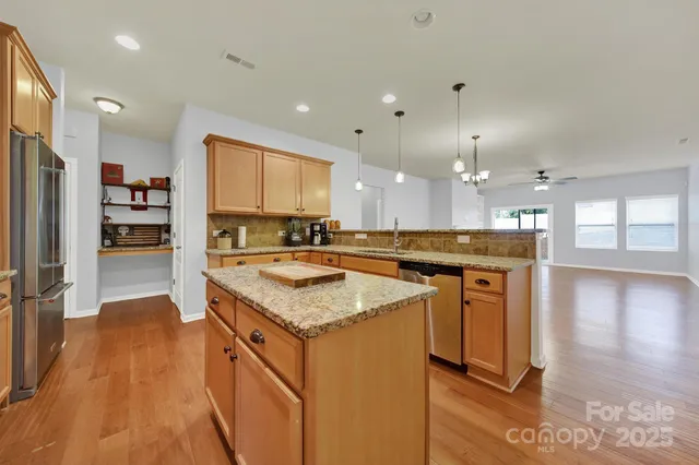 a view of kitchen with wooden floor