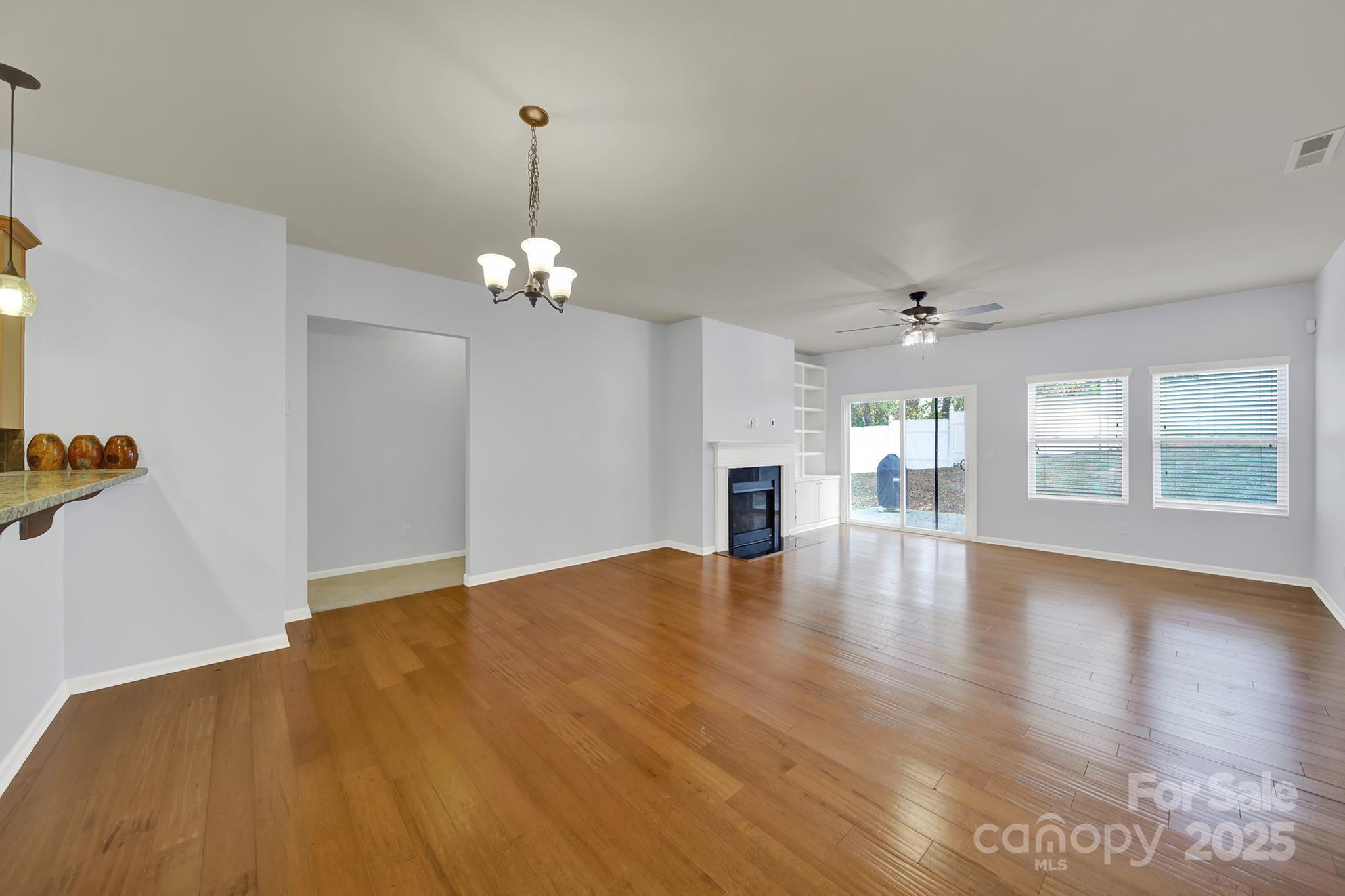 1726 Still River Way Fort Mill, SC 29708 - Photo 23 of 45 a view of an empty room with window and wooden floor