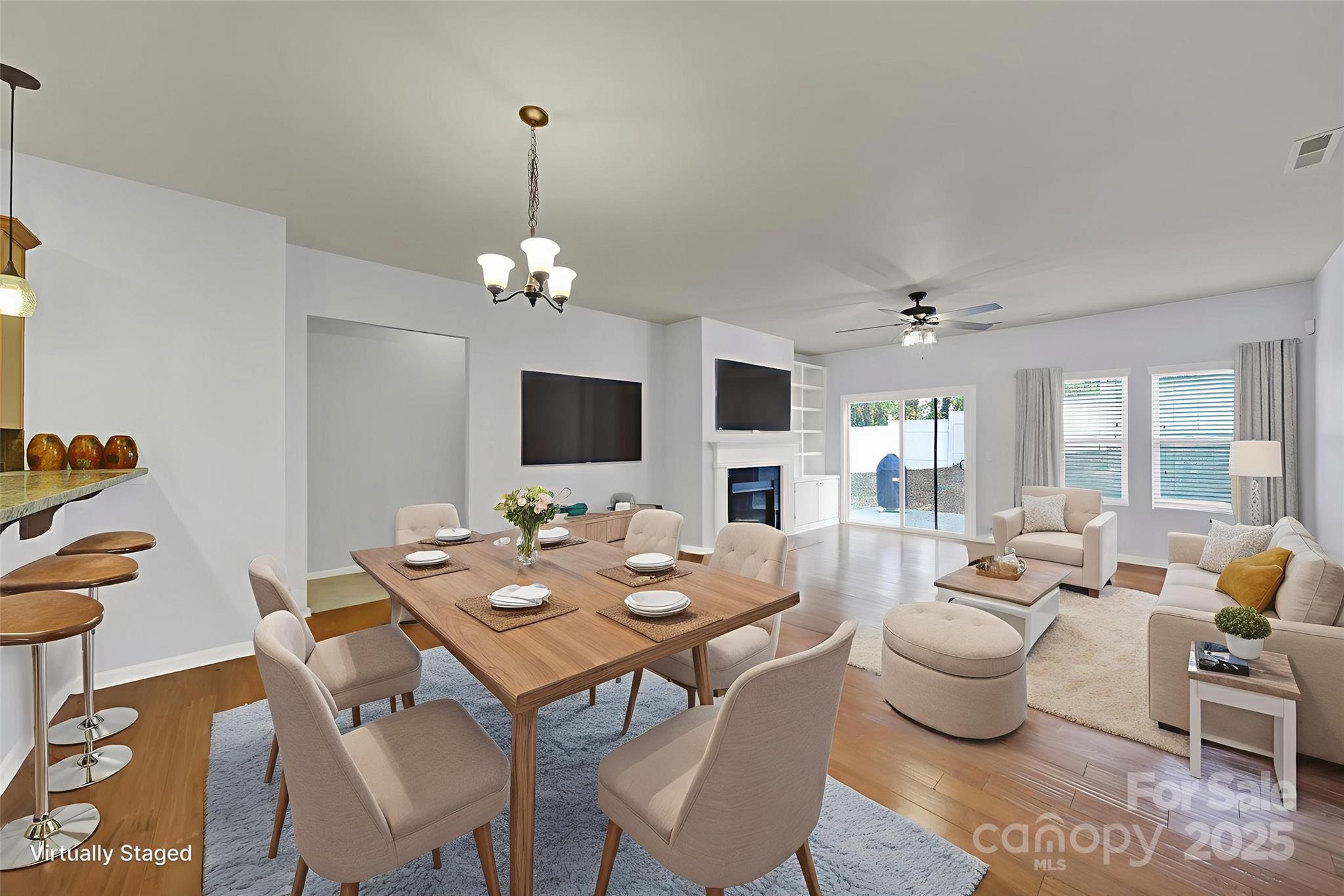 1726 Still River Way Fort Mill, SC 29708 - Photo 24 of 45 a view of a dining room with furniture a chandelier and wooden floor