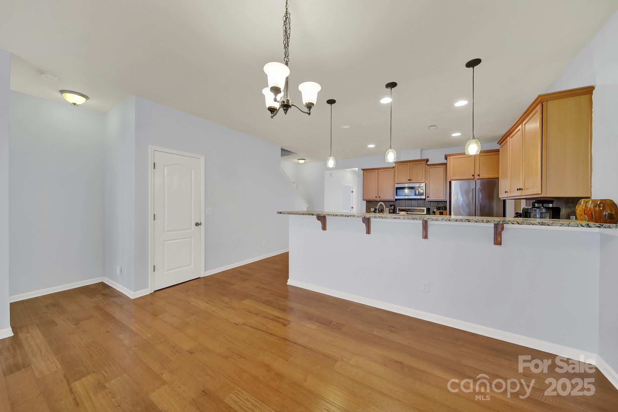 1726 Still River Way Fort Mill, SC 29708 - Photo 25 of 45 a view of kitchen with refrigerator and ceiling fan