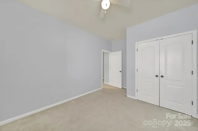 a bathroom with a sink double vanity granite toilet and a bathtub