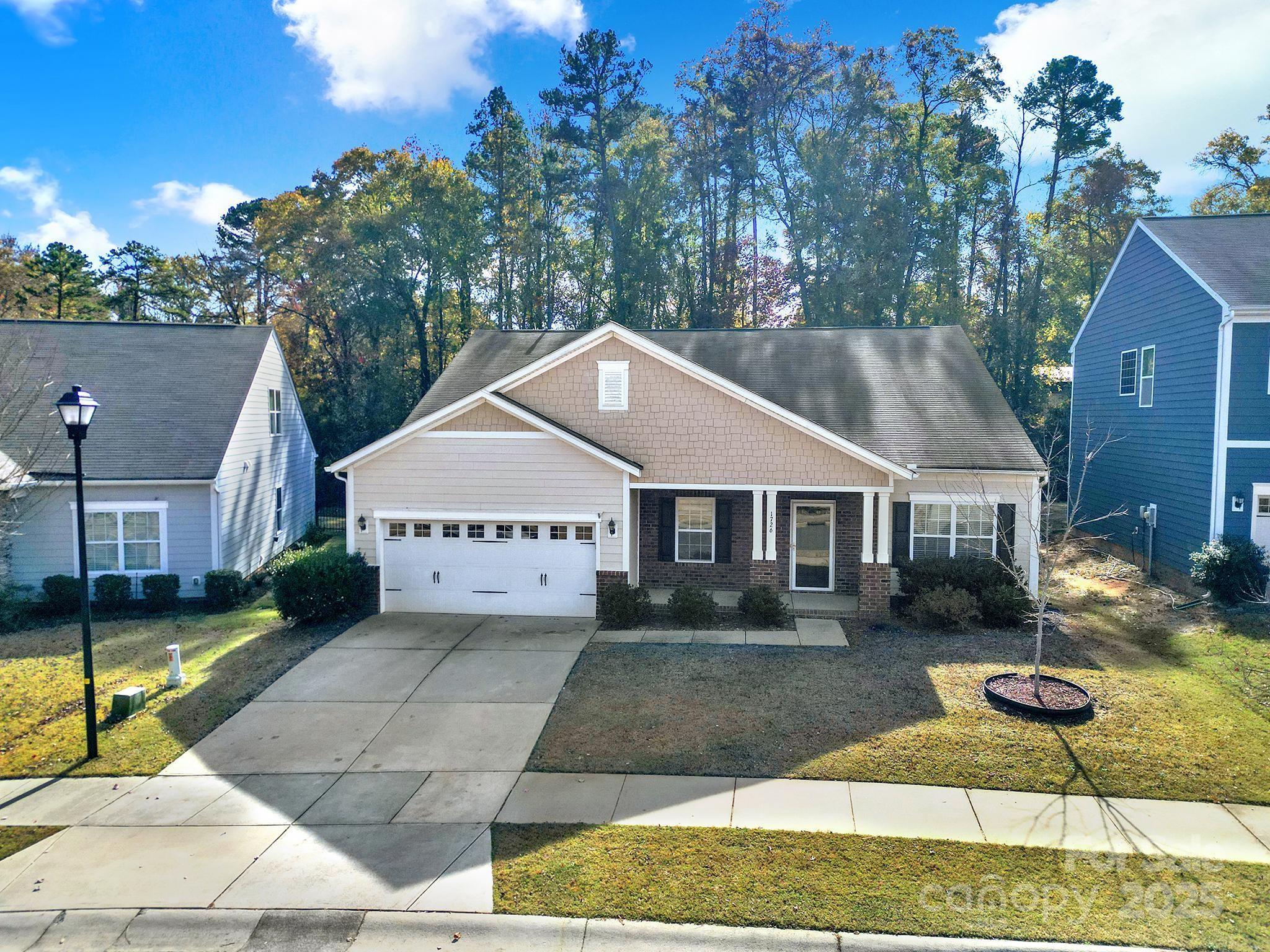 1726 Still River Way Fort Mill, SC 29708 - Photo 3 of 45 a house with trees in the background
