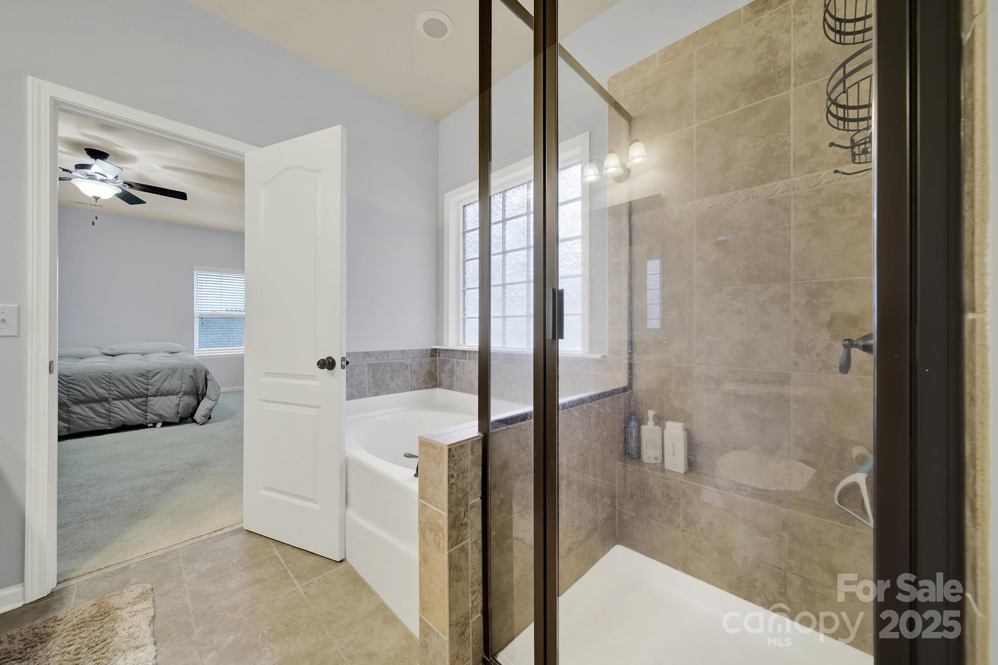 1726 Still River Way Fort Mill, SC 29708 - Photo 35 of 45 a en suite bathroom with a double vanity sink a mirror and a shower