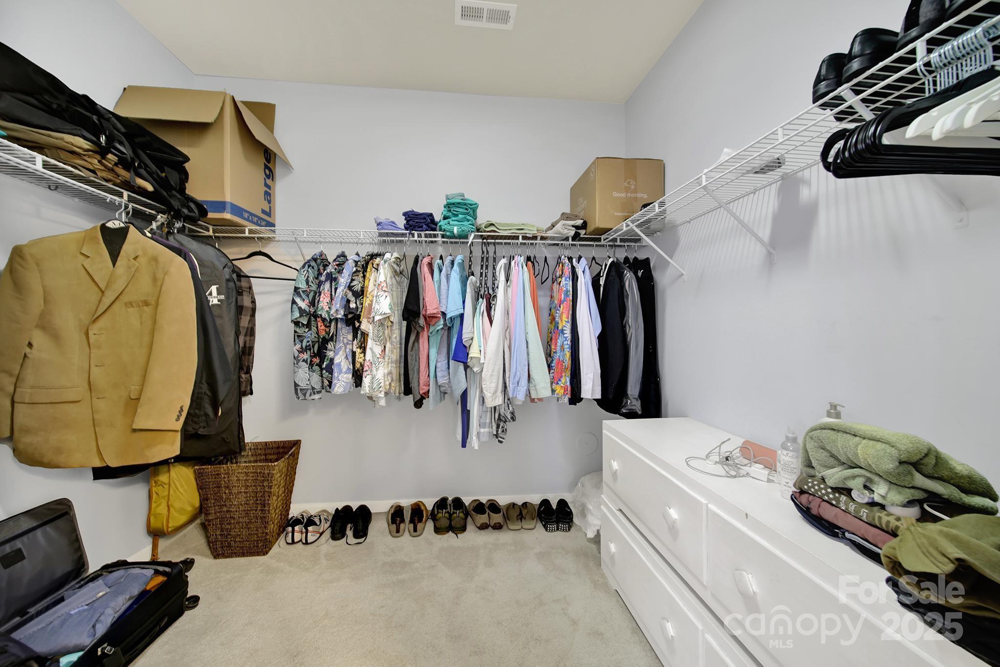 1726 Still River Way Fort Mill, SC 29708 - Photo 36 of 45 a view of walk in closet with clothes and shoes