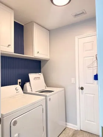 a view of storage and utility room with washer and dryer