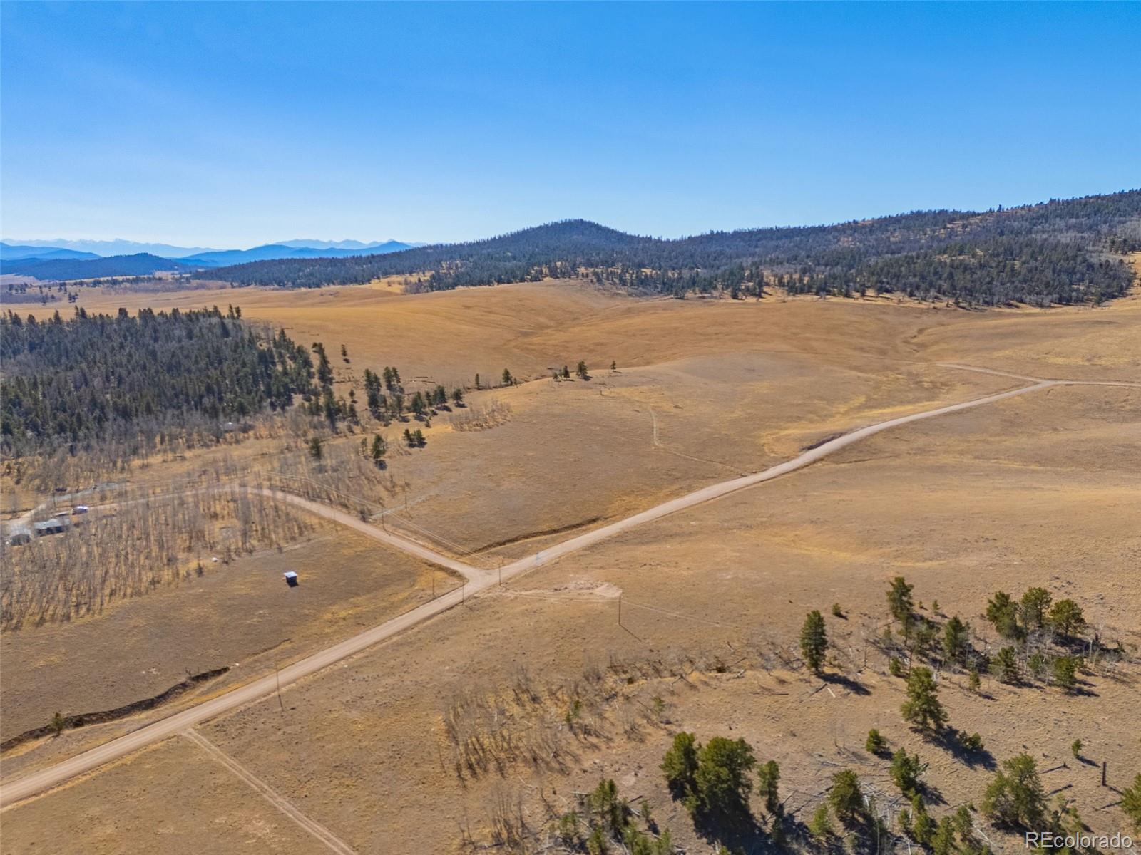 11414 Ranch Road Hartsel, CO 80449 - Photo 9 of 11 a view of a lake with a mountain