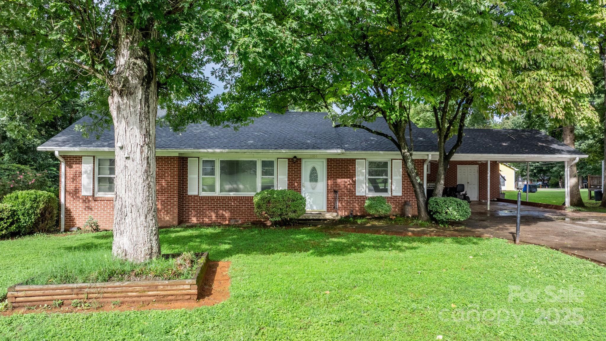 front view of a house with a yard
