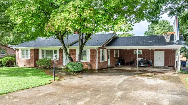 a view of a house with backyard porch and sitting area