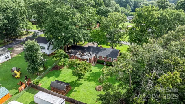 a backyard of a house with outdoor seating and green space