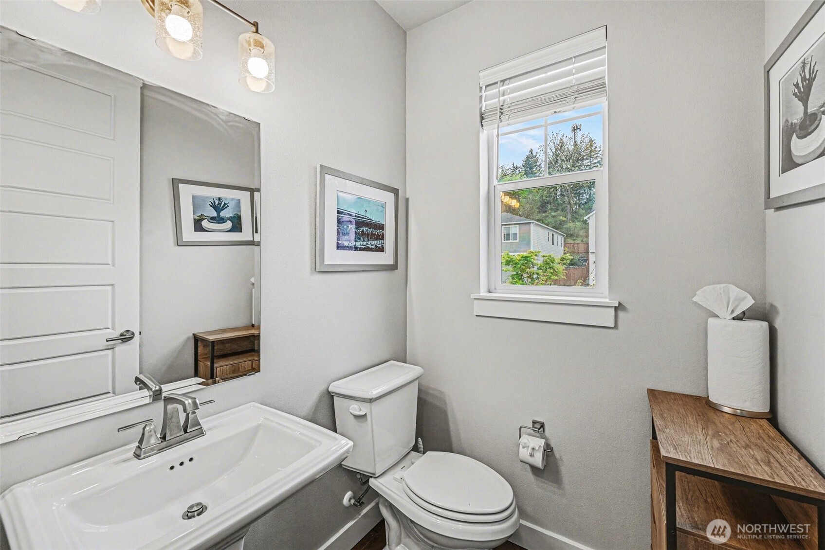 9779 Prospect Place Gig Harbor, WA 98332 - Photo 12 of 33 a bathroom with a toilet a sink and mirror