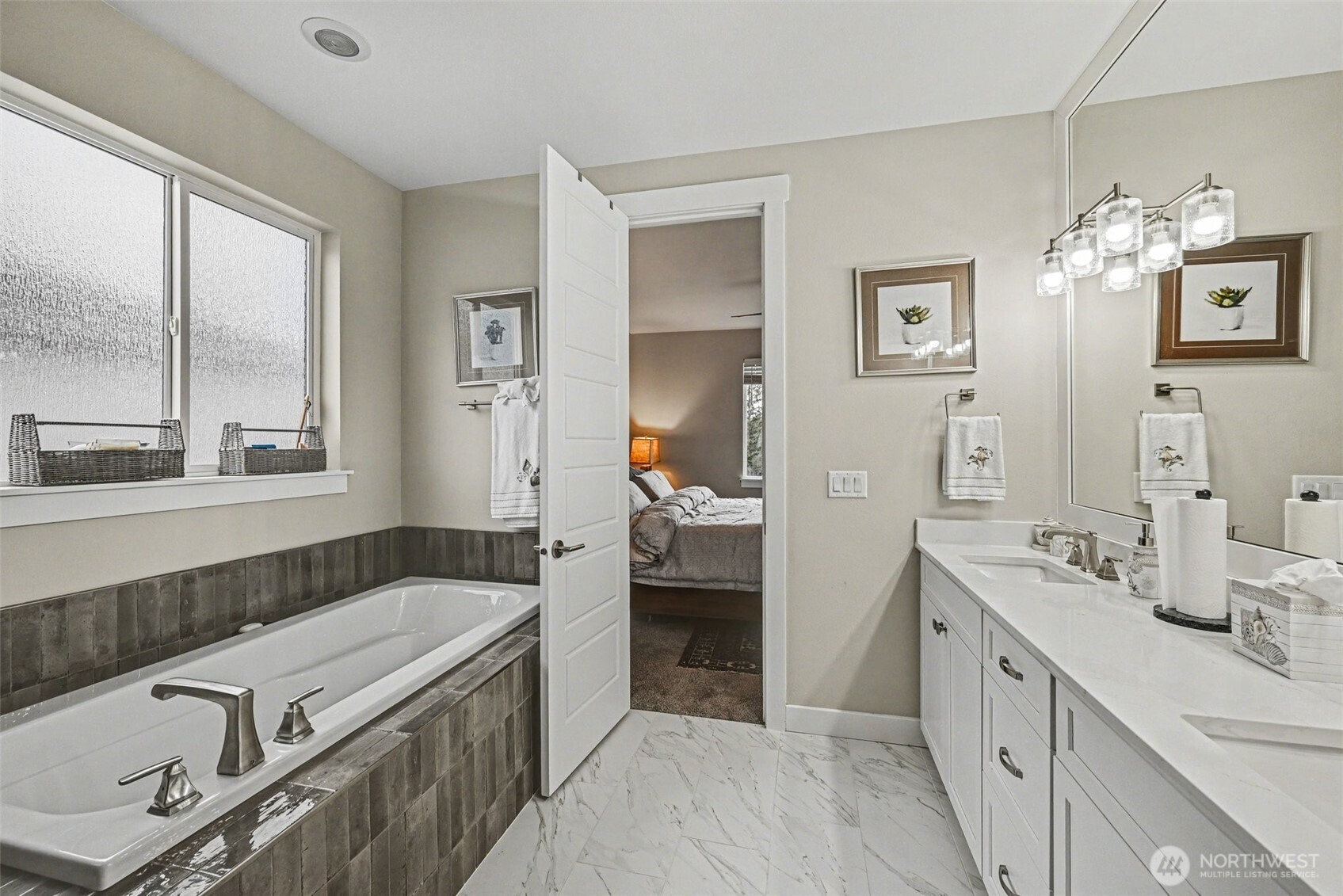 9779 Prospect Place Gig Harbor, WA 98332 - Photo 19 of 33 a spacious bathroom with a granite countertop double vanity sink a mirror and a shower