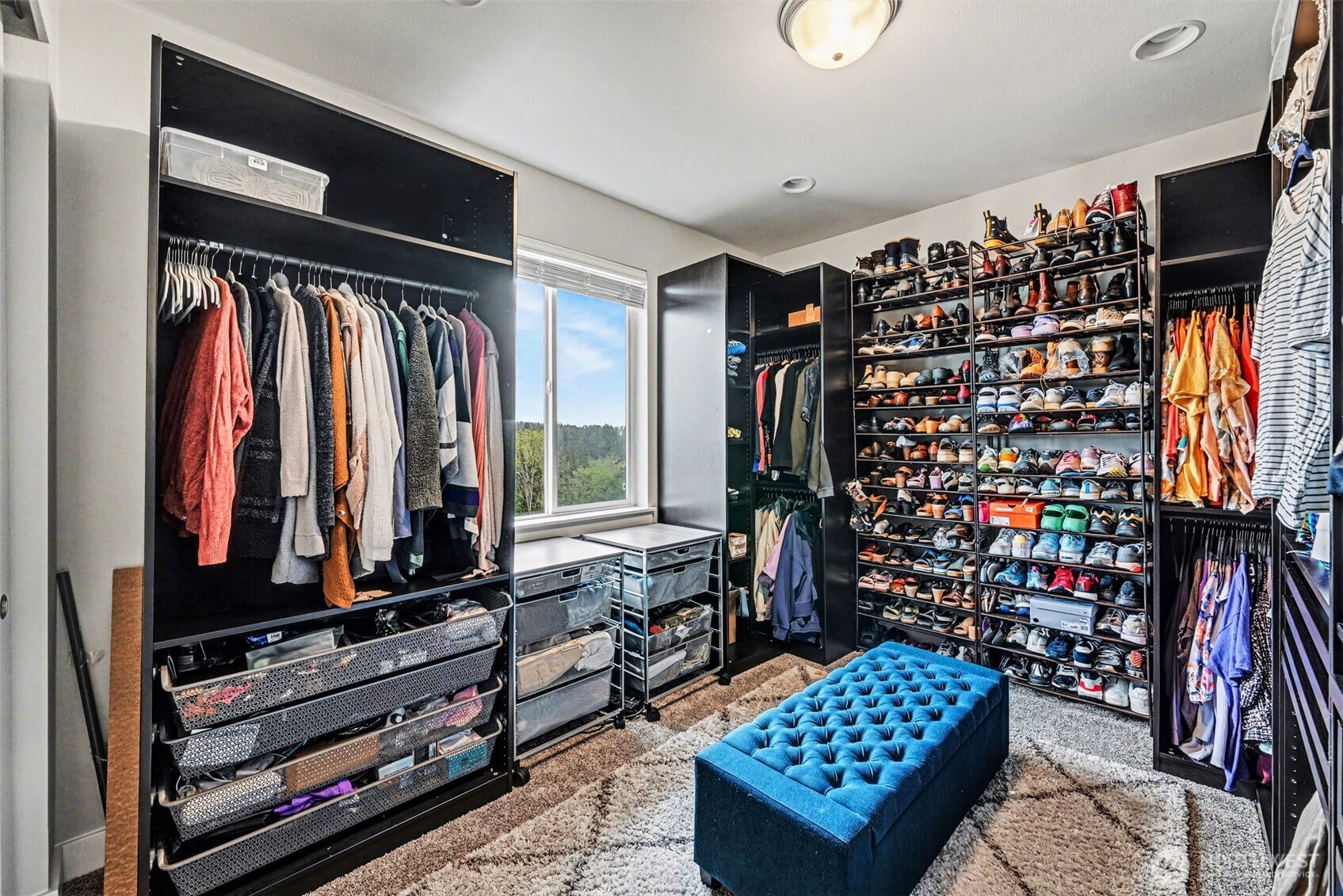 9779 Prospect Place Gig Harbor, WA 98332 - Photo 22 of 33 a view of walk in closet with clothes and shoes