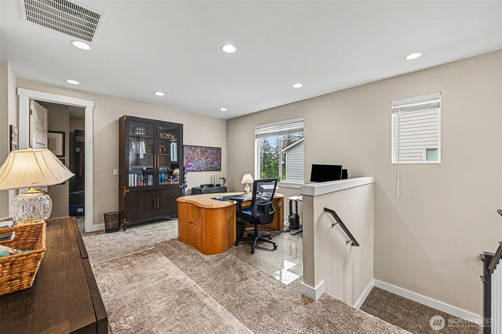 9779 Prospect Place Gig Harbor, WA 98332 - Photo 23 of 33 a living room with furniture a flat screen tv and a refrigerator
