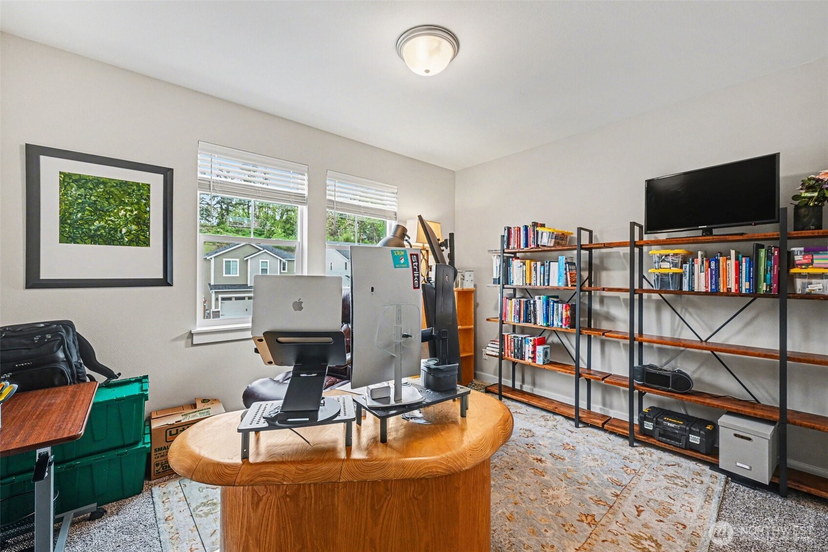 9779 Prospect Place Gig Harbor, WA 98332 - Photo 25 of 33 a living room with furniture and a flat screen tv