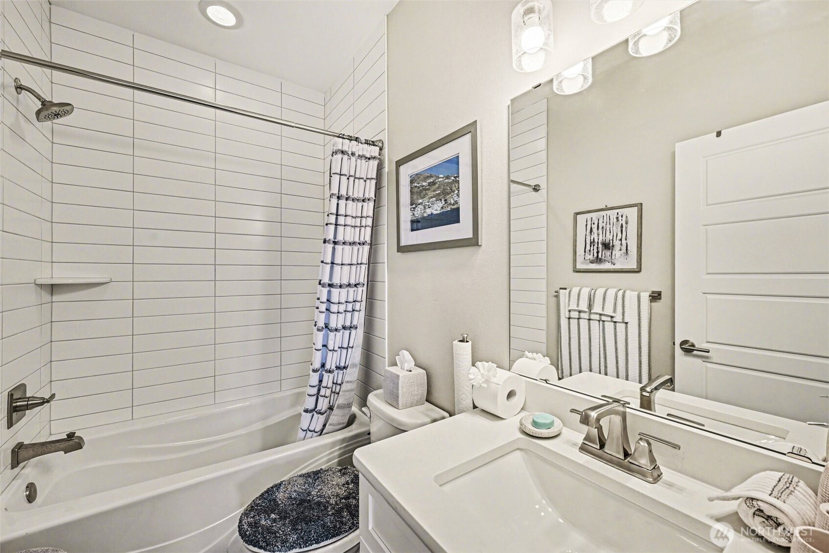 9779 Prospect Place Gig Harbor, WA 98332 - Photo 26 of 33 a bathroom with a sink a toilet and shower