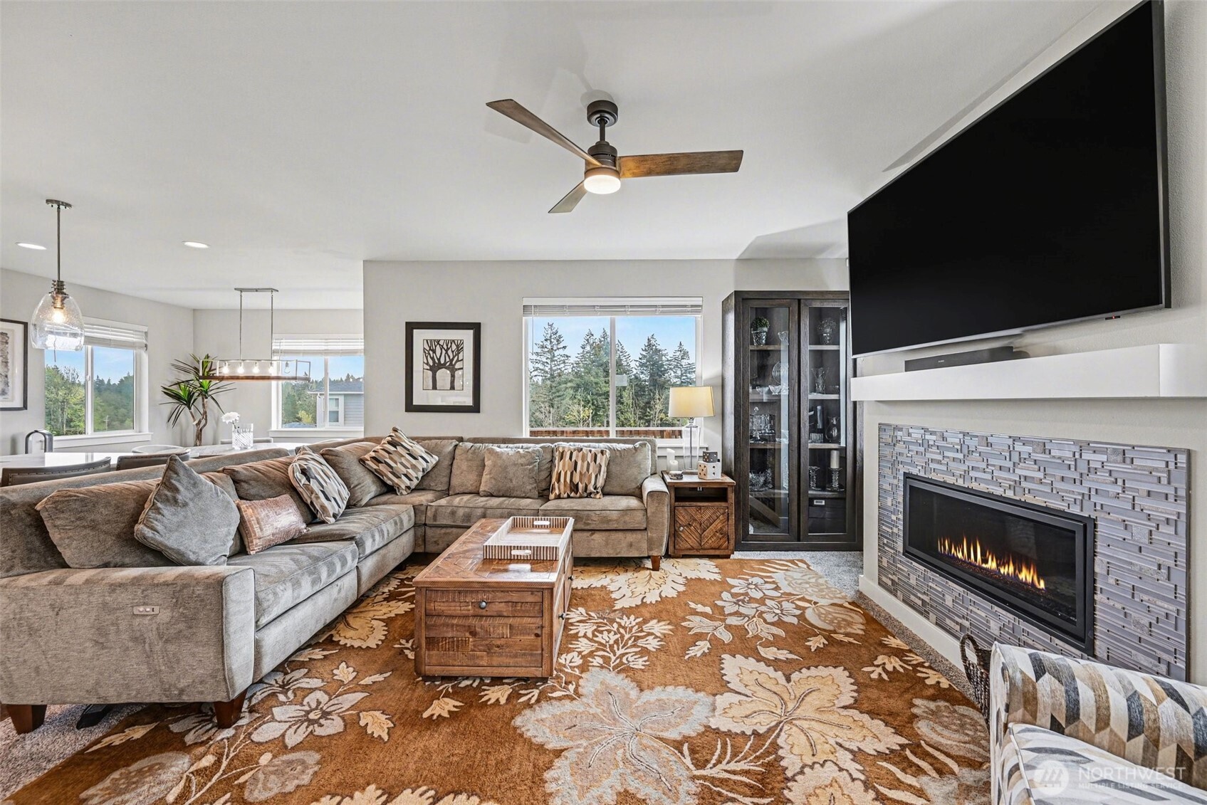 9779 Prospect Place Gig Harbor, WA 98332 - Photo 5 of 33 a living room with furniture fireplace and flat screen tv