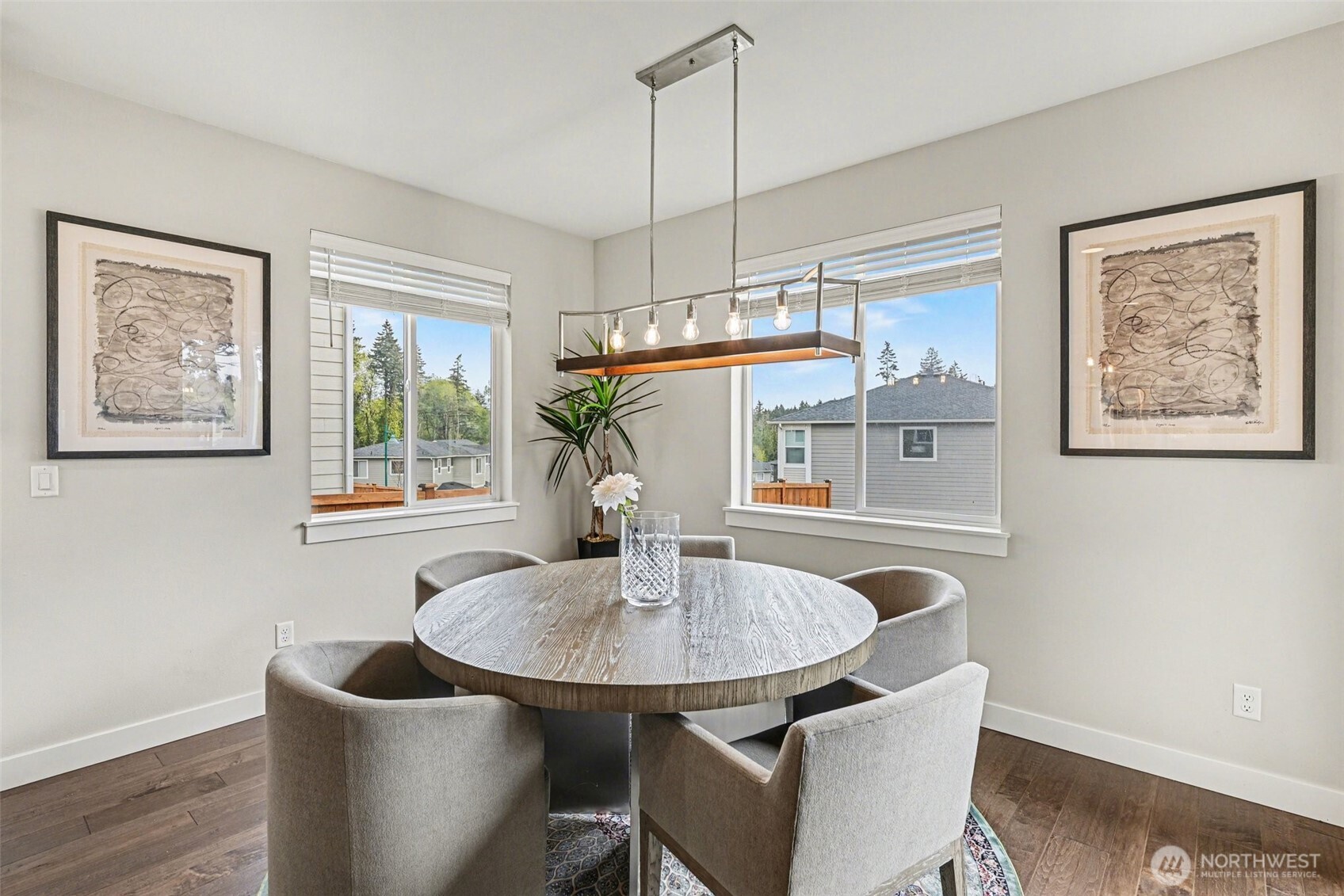 9779 Prospect Place Gig Harbor, WA 98332 - Photo 8 of 33 a kitchen with a table and chairs