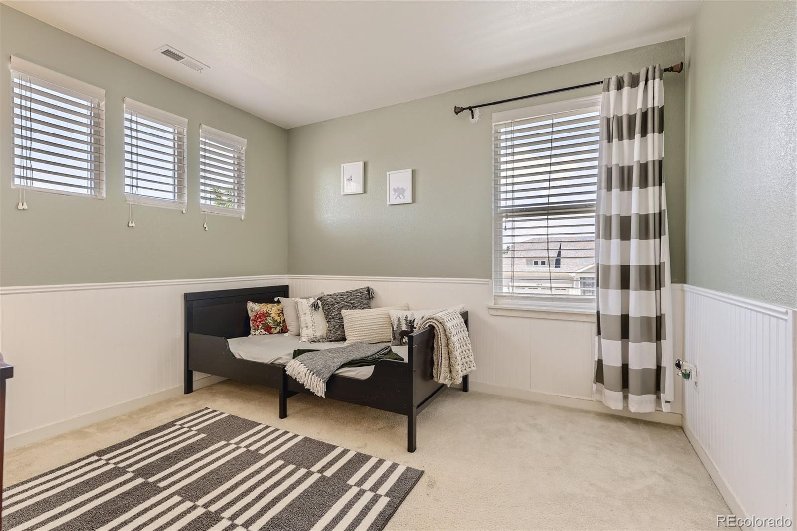 17021 White Alba Lane Parker, CO 80134 - Photo 14 of 21 a living room with furniture and a window