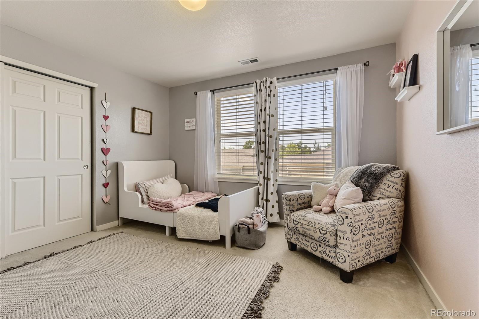 17021 White Alba Lane Parker, CO 80134 - Photo 15 of 21 a living room with furniture and a window
